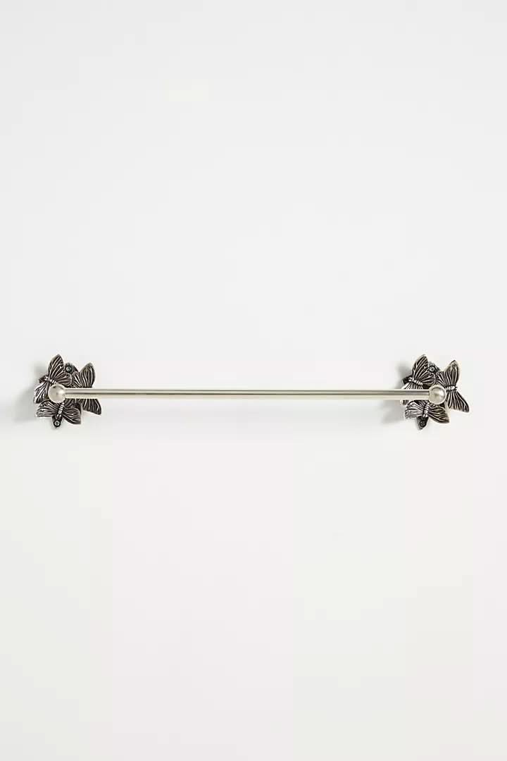Silver butterfly-design wall-mounted bathroom accessories set on a white background.